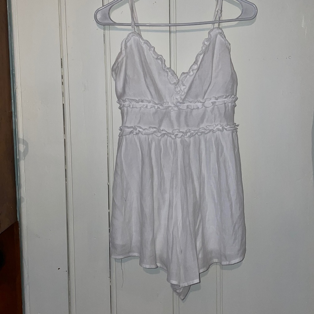 Size small white woman’s romper from Francesca’s.